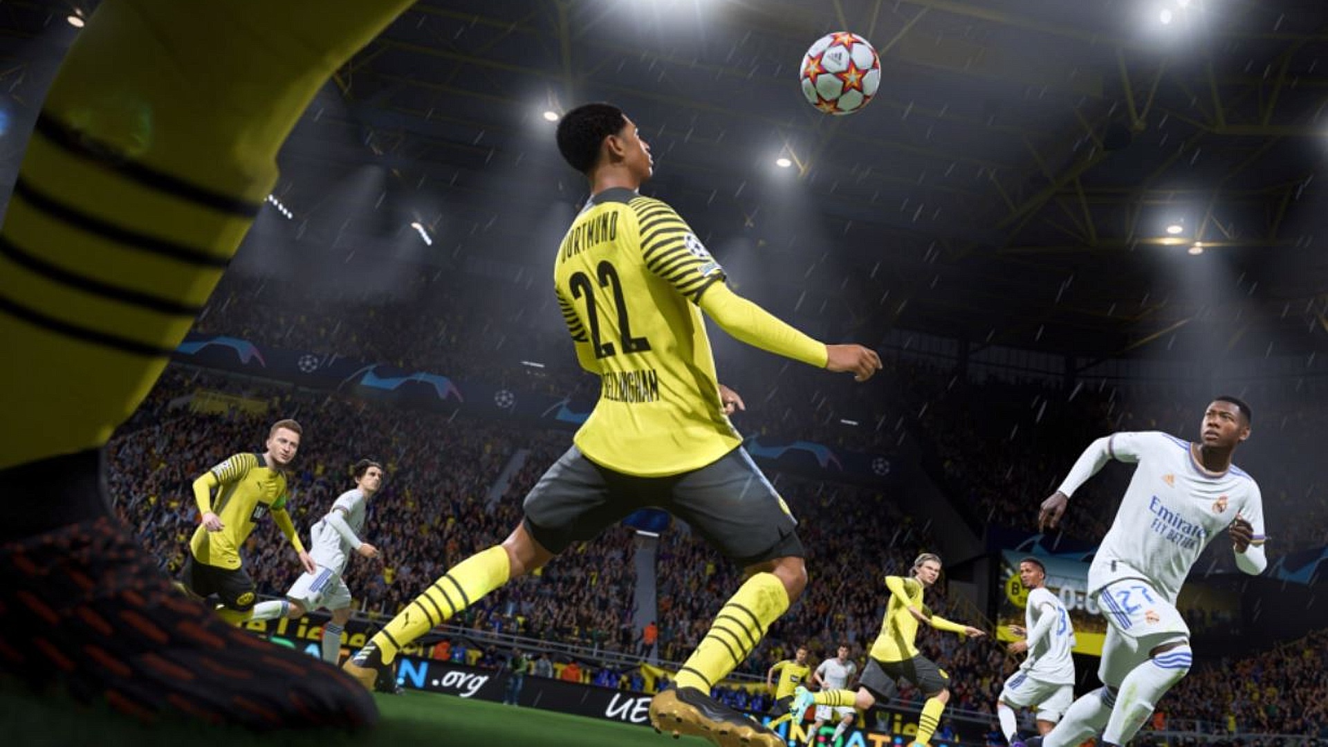 FIFA 22 HyperMotion: FIFA 22 screenshot of Dortmund's Jude Bellingham, wearing a yellow and black kit, controlling a football with his chest.