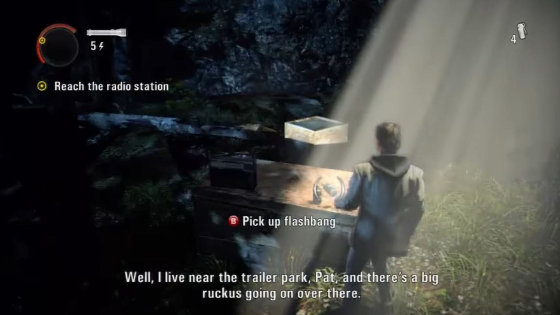 Alan Wake Remastered radios: Alan is looking at the box with the radio on. 