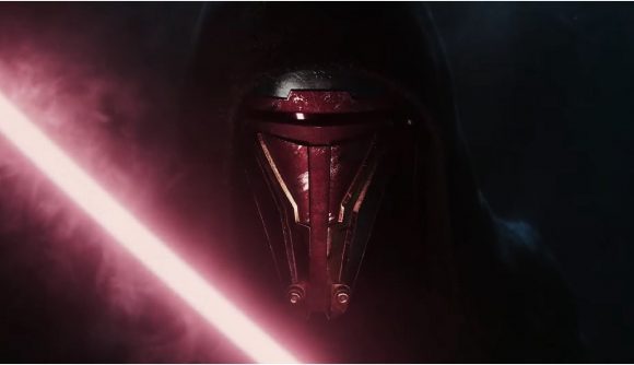 A person can be seen with a lightsaber.