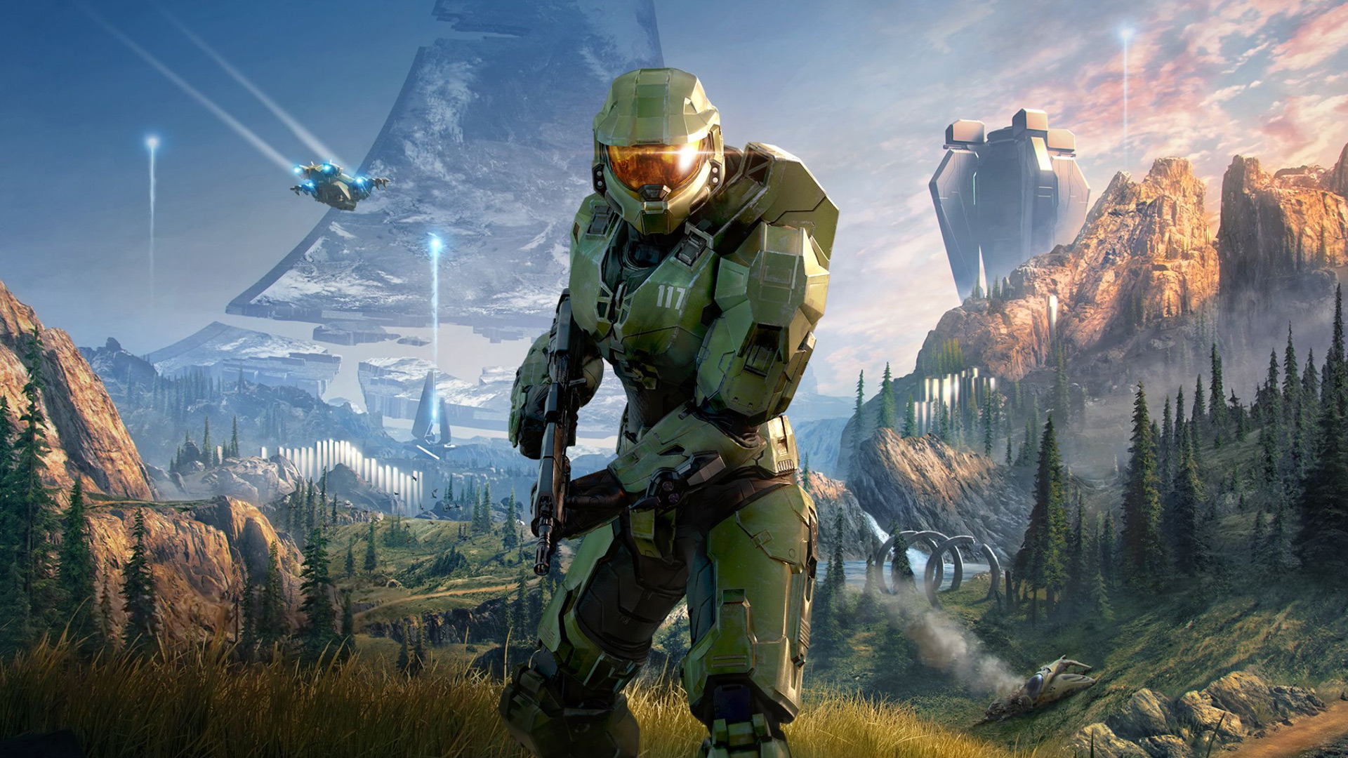 Halo games in order: Halo Infinite art showing a battle-ready Master Chief against the verdant hills of a Halo ring.