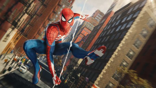 Best open world games: Spider-Man swinging on a web through a city street.