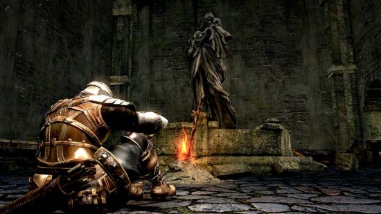 Best Souls Likes Games: An image of a Knight kneeling at a bonfire in Dark Souls.
