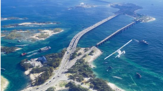 GTA 6 release date: an aerial view of two small islands connected by a highway with a small plane flying overhead